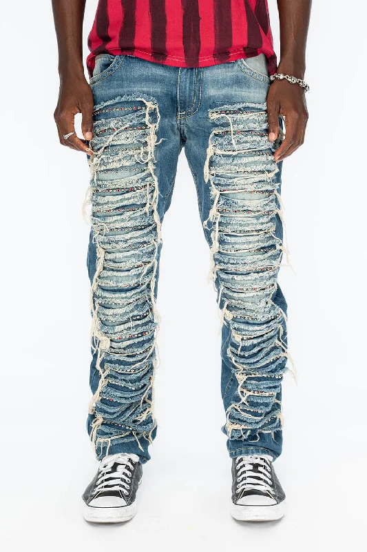 MARLON RIPPED,BROKEN HAND REPAIRED DENIM JEANS IN MANDAN BLUE WITH STUDS AND CRYSTALS Monochromatic All MARLON RIPPED,BROKEN HAND REPAIRED DENIM JEANS IN MANDAN BLUE WITH STUDS AND CRYSTALS Monochromatic All